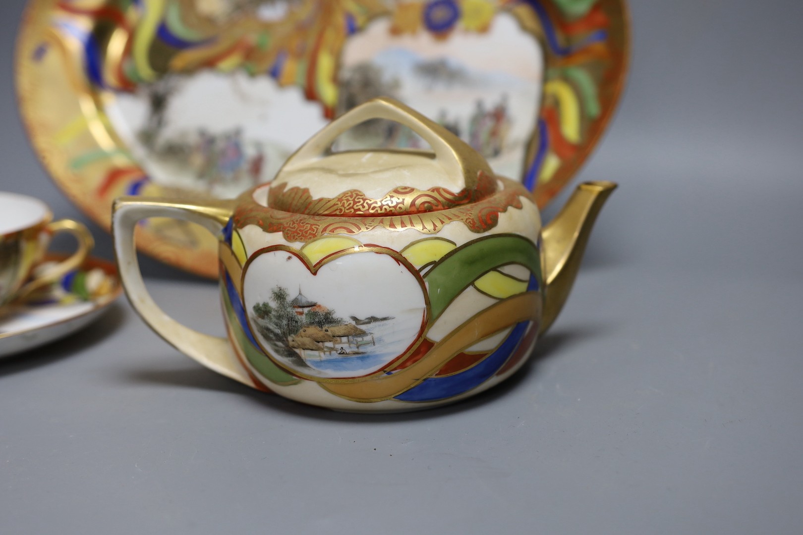 A Japanese Kutani porcelain teaset for 10 and a Japanese floral teapot